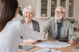 Elderly Couple Buying Home