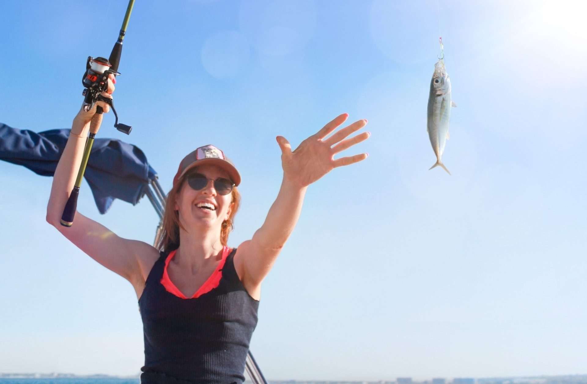 A woman fishing with a valid Maryland tidal fishing license