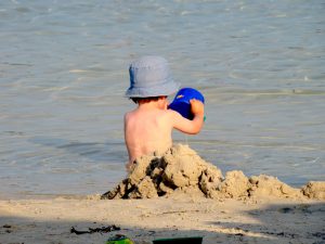 Beach Goers Child Playing in the Sand