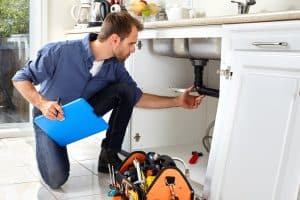 Home Inspector under a sink