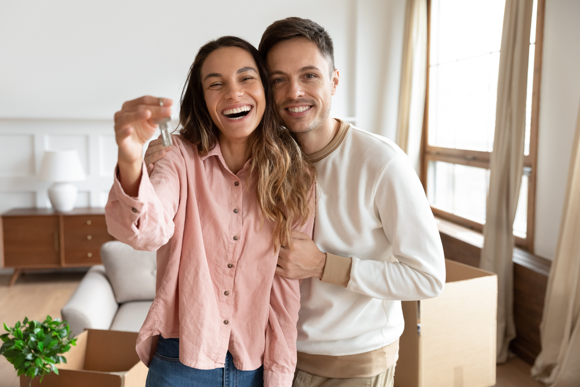 Home Buyers With Key to New House