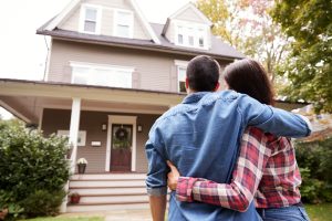 A young couple looking at their new house