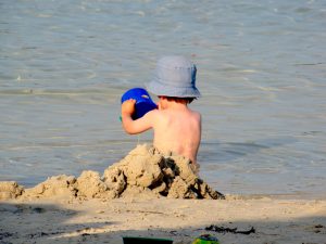 Child playing in the sand