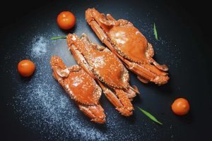 Three steamed crabs on a plate