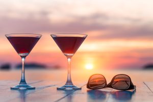 Two cocktails with the sun setting