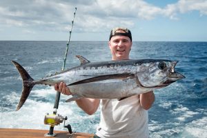 Man with a large tuna he just caught