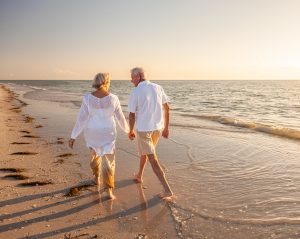 Retired Couple Walking on the Beac