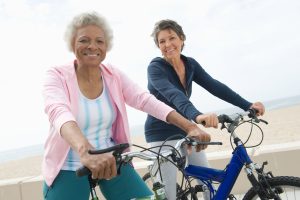 Two retired women biking